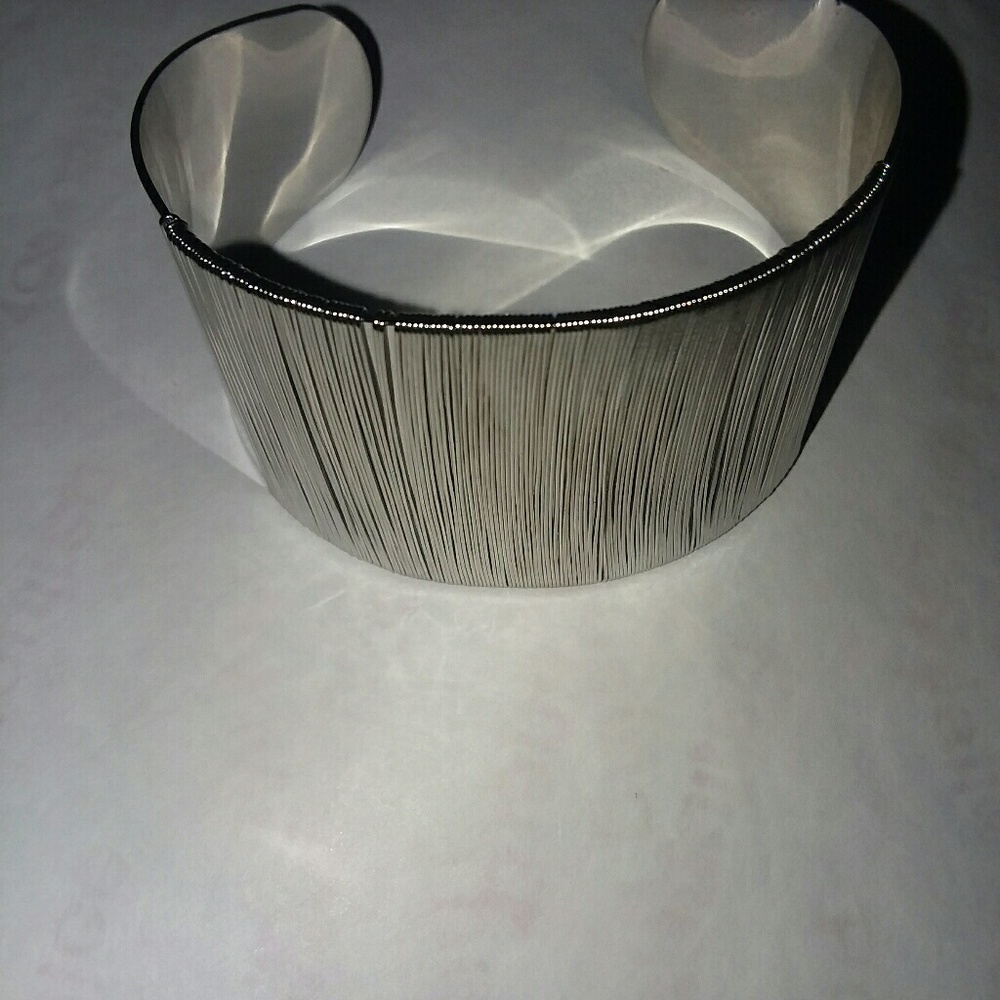 A silver string bangel